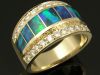 14k gold ladies ring inlaid with Australian opal accented by diamonds.