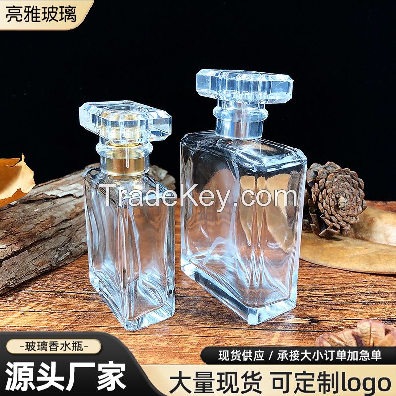 Cylindrical glass perfume bottle
