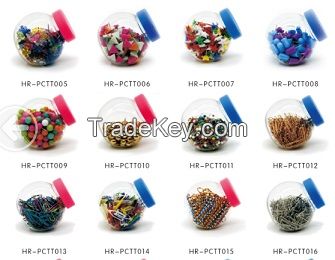 supplys kinds of pins, paper clips, tumb tacks in a PET candy jar box