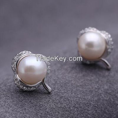 big pearls  brass earrings set with CZ and white rhodium plating