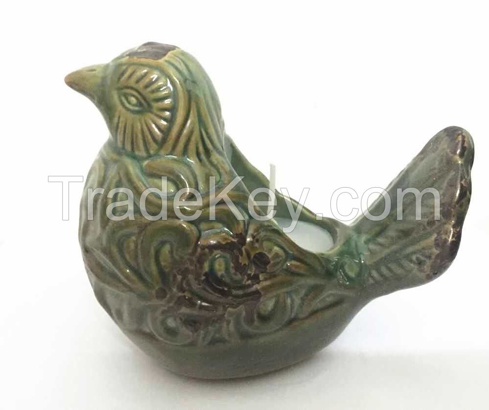 Bird Figurine candle holder with citronella wax filled.