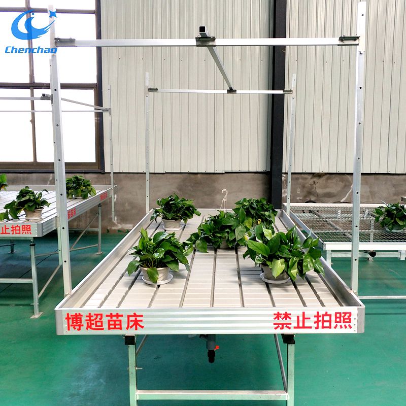 Greenhouse ebb and flow rolling table for growing plants