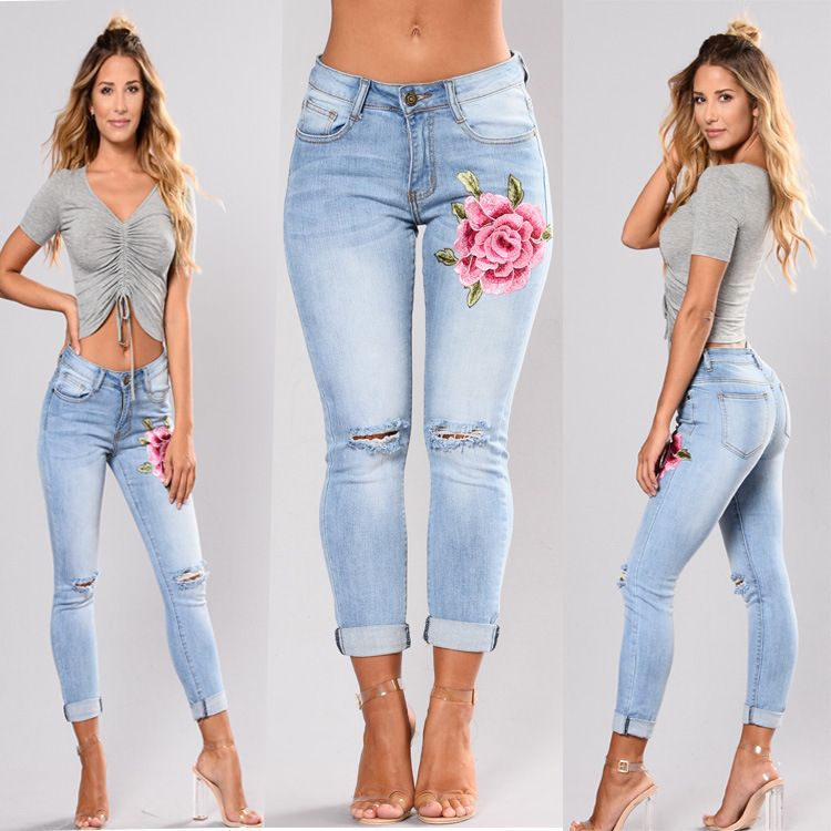 Denim trousers for women with high stretch embroidery and torn holes