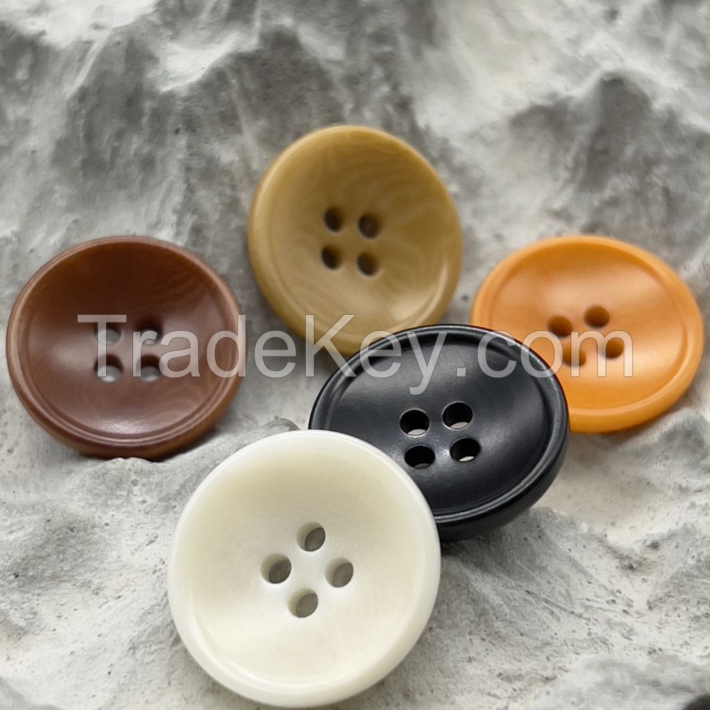 Bowl shape corozo buttons in white, orange, ginger, chesnut and black