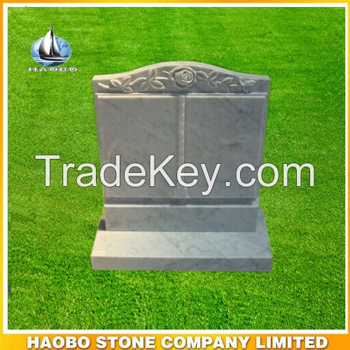 White marble book shape monument with rose engraving