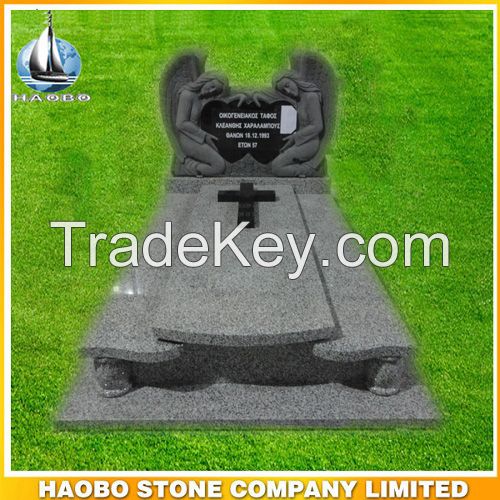 Granite tombstone with double carved black angels