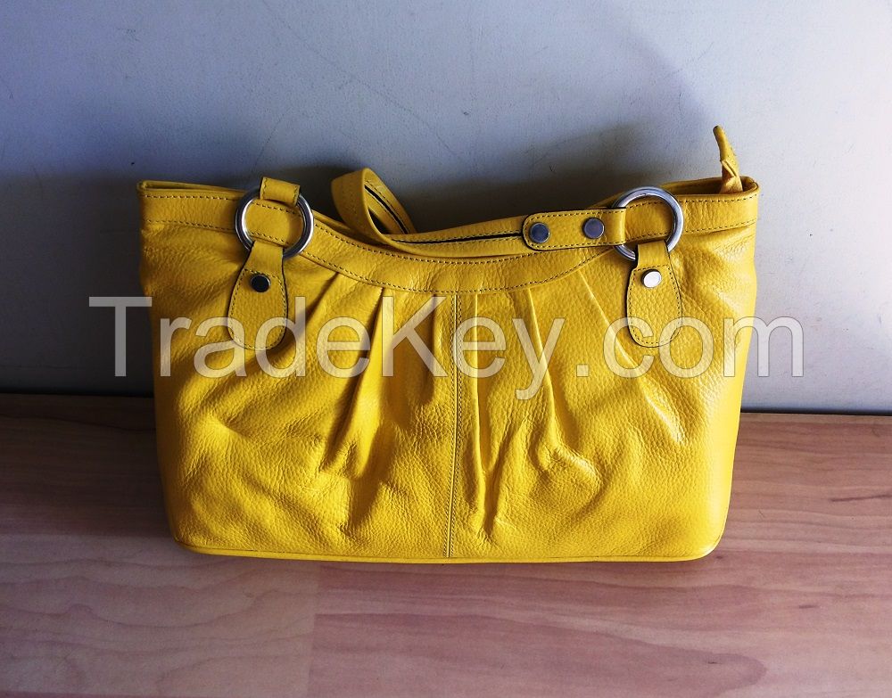Yellow color genuine leather handbag