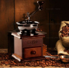 Vintage machine hand grinding coffee beans