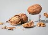 walnuts in shell with extra light walnut kernels