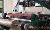 Woven fabric laminating machine