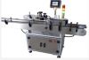 Automatic labeling machine for vertical bottle