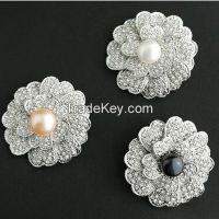 pearls and CZ flower shaped pendants/brooches
