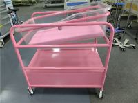 Tilting baby cribs with storage drawer