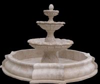 Antiqued stone fountain