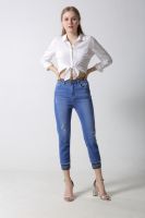 Woman's denim capril with emboridery at waistband and hem