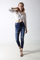 Woman's Slim denim jeans with rips and distressed patches