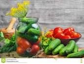 Assorted pickled cucumbers and tomatoes