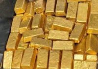 gold bars , gold nuggets . gold dust