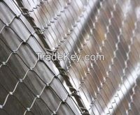 Architectural coil metal drapery