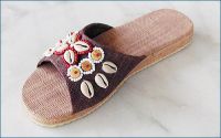 Sell sandal in native design with shell accent