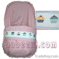 Pink hand smocked seat cover