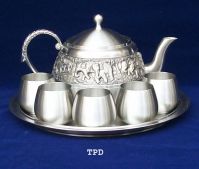 Tea pot and cup pewter