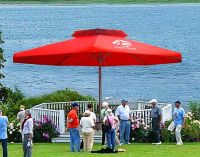 Super size umbrella with two-tier ventilated top and crank.