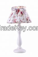 Table lamp with flower skirt shade