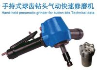 hand-held pneumatic grinder for button bits