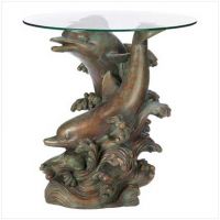 Sell glass-topped dolphin sculpture table