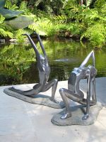 Stainless- looking Yoga girl sculpture