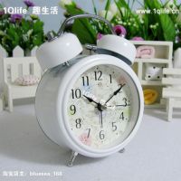 White colored traditional alarm clock