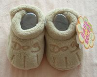 grey baby shoes with paw