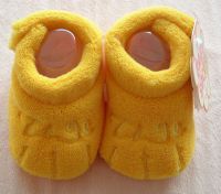 yellow baby shoes with paw