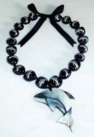Black kukuinut with dolphin shell pendant