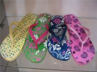 Sell colourful slippers