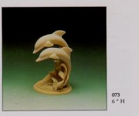 Selling scupture of dolphins