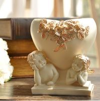 Sell Resin angel with heart shaped planter