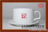 Handpainted ceramic coffee mug with saucer
