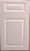 Cabinet door with PVC membrane