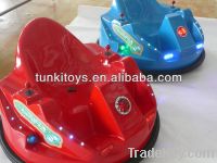 children driving bumper car