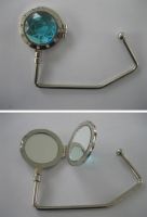 Sell purse hanger/bag holder with compact mirror