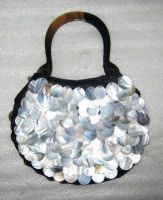 Horn and shell handbags with hand embroidery made by craftsmen