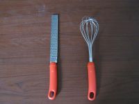 egg whisk, orange plastic handle whisk