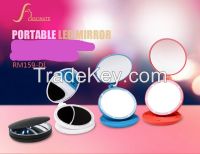 Portable plastic travel mirror for makeup with LED lighting, powered by AAA battery