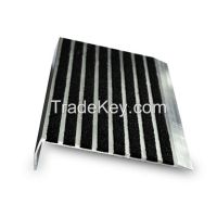 Skid-resistant metallic stair nosing for tile