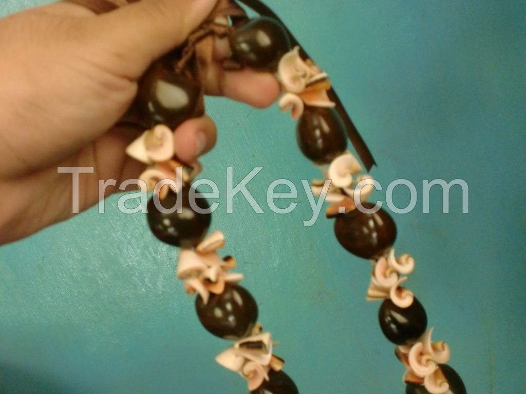 black or brown kukui with white monggo ring or red everlasting necklace