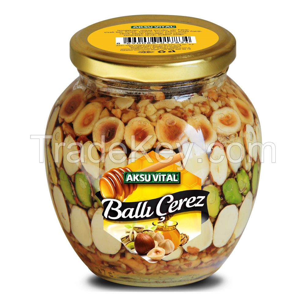 Glass jars with honey and nuts. Almonds and hazelnuts in honey in