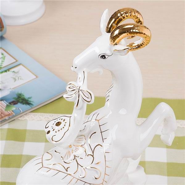 Goat and Shoeshaped Gold Ingot Porcelain Figurines With Gold Outline