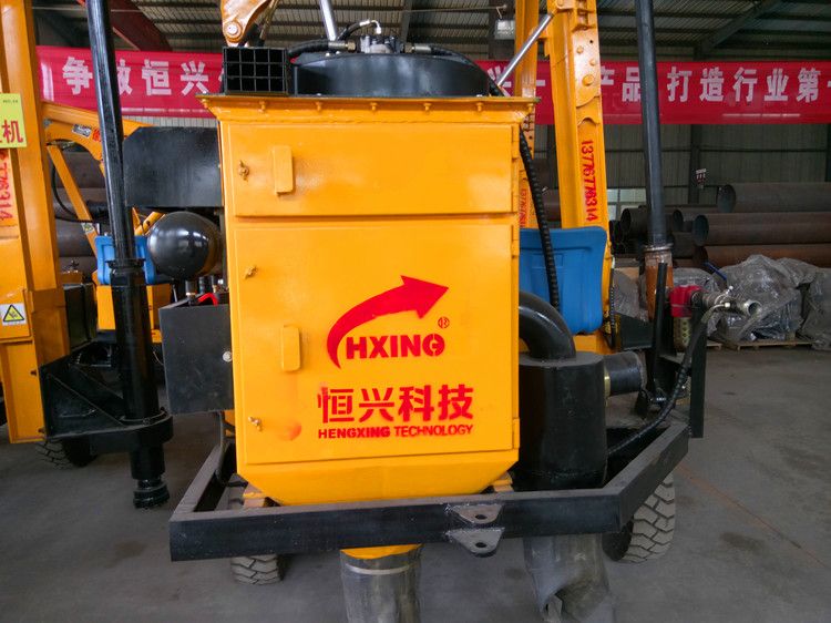 Rock drilling machine pile driver with dust remover for hard construction site